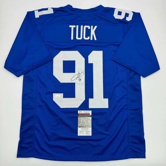 Blue New York Giants jersey signed by sports legend, perfect for professional sports fans