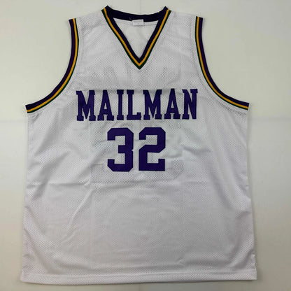 White custom jersey with purple, gold, and green trim from K Malone 32 professional sports league