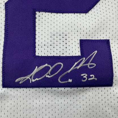 Autographed purple and white custom jersey from a professional sports league
