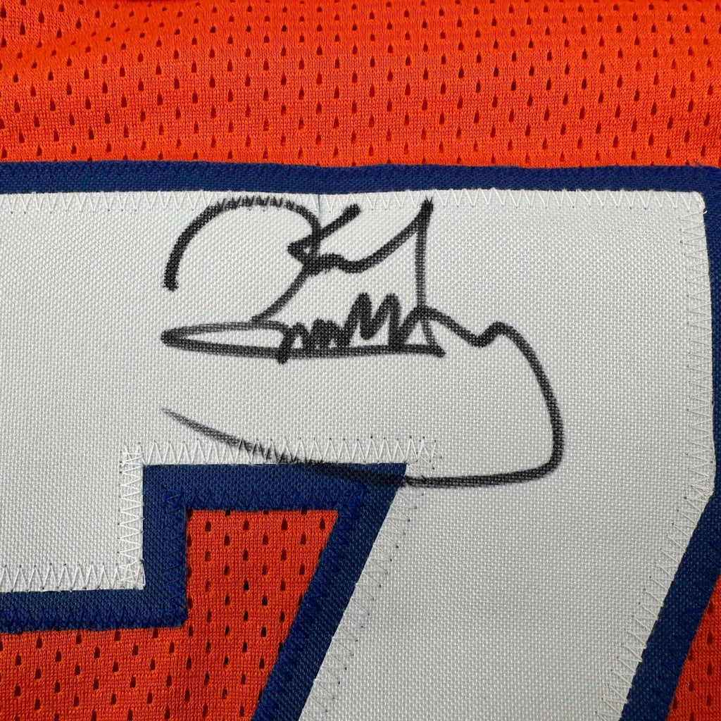 Black ink signature on white fabric patch of orange and blue karl mecklenburg denver football custom jersey