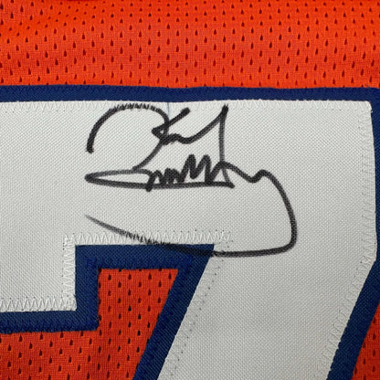 Black ink signature on white fabric patch of orange and blue karl mecklenburg denver football custom jersey