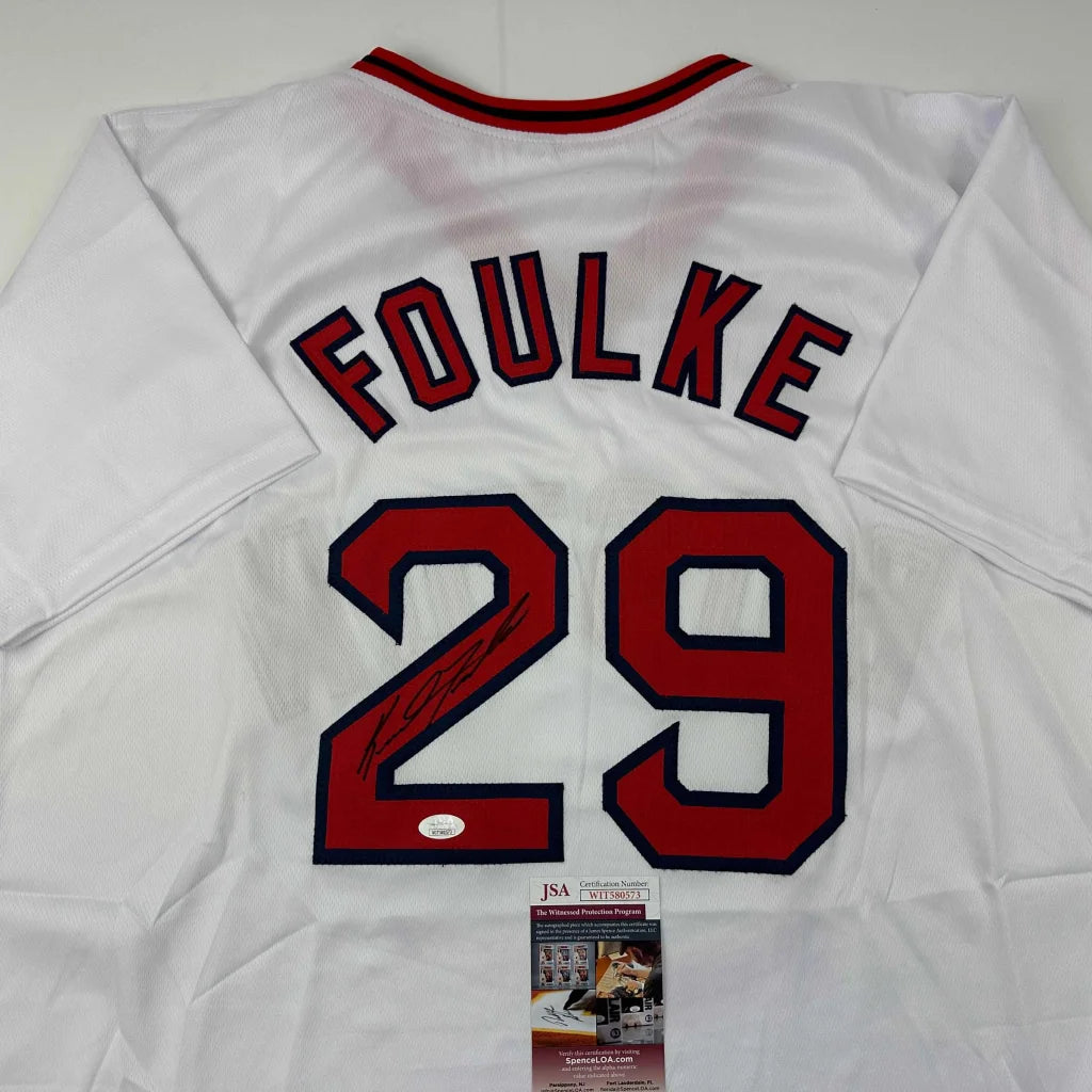 Autographed white baseball jersey with FOULKE 29 in red and blue for sports fans
