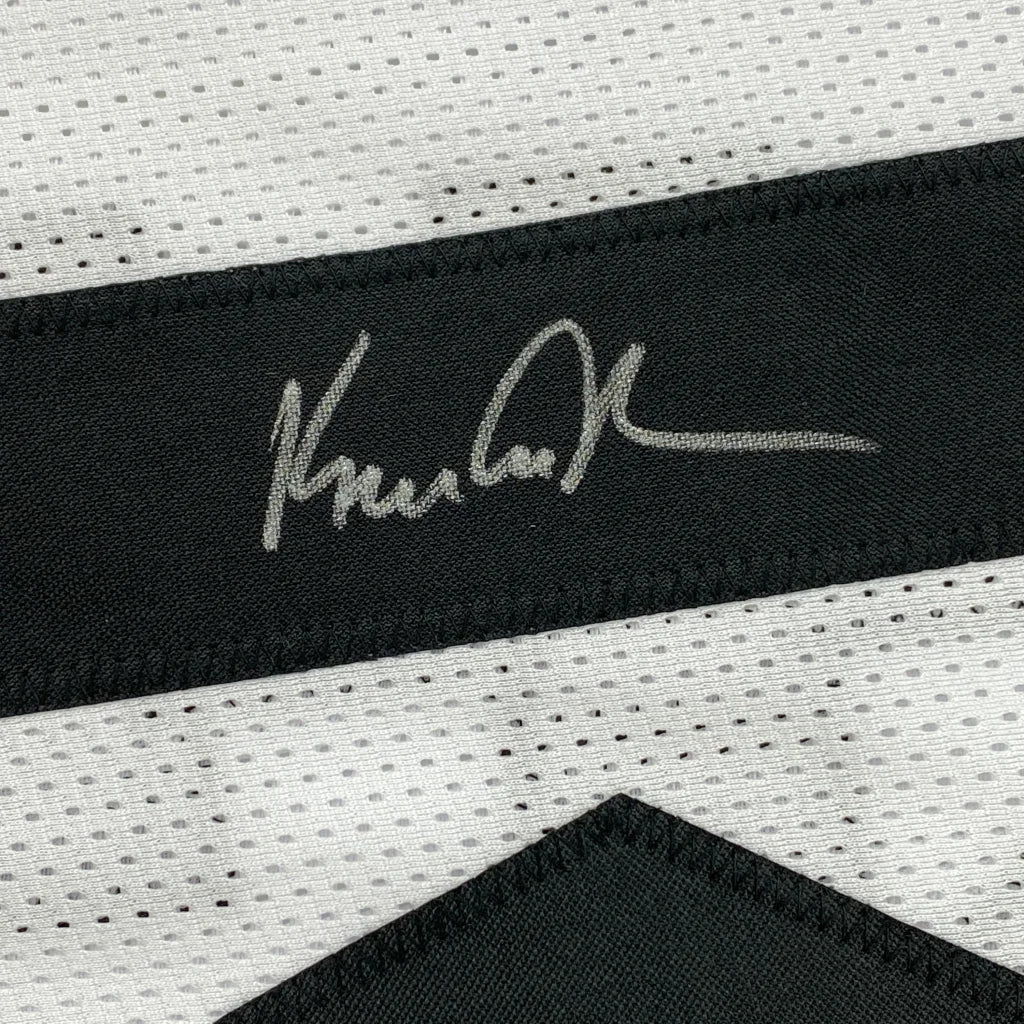 Autographed black and white custom jersey from a professional sports league collectible