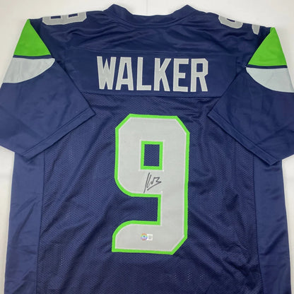 Dark blue custom jersey with green gray accents and autograph from a pro sports league