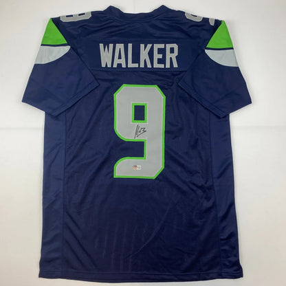 Dark blue custom jersey with gray numbers and green trim from professional sports league