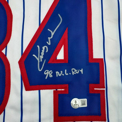 White pinstripe baseball jersey with blue red 84 and signed inscription from professional sports league