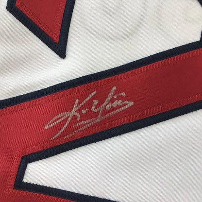 White custom jersey with red and navy trim and a gold autograph for professional sports fans