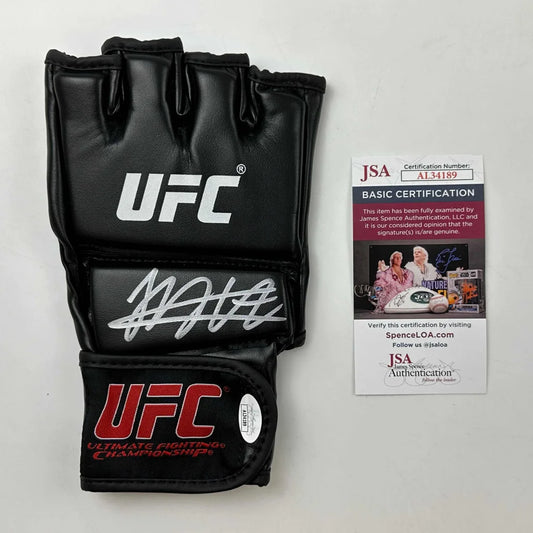 Black UFC MMA glove with white autograph and JSA certification for authentic fight gear