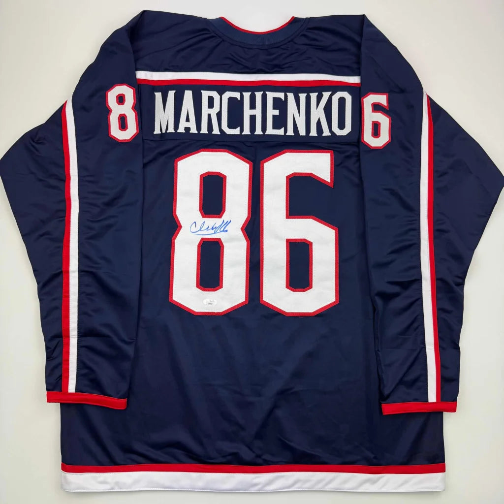 Autographed Kirill Marchenko custom jersey in navy blue with white red trim 86