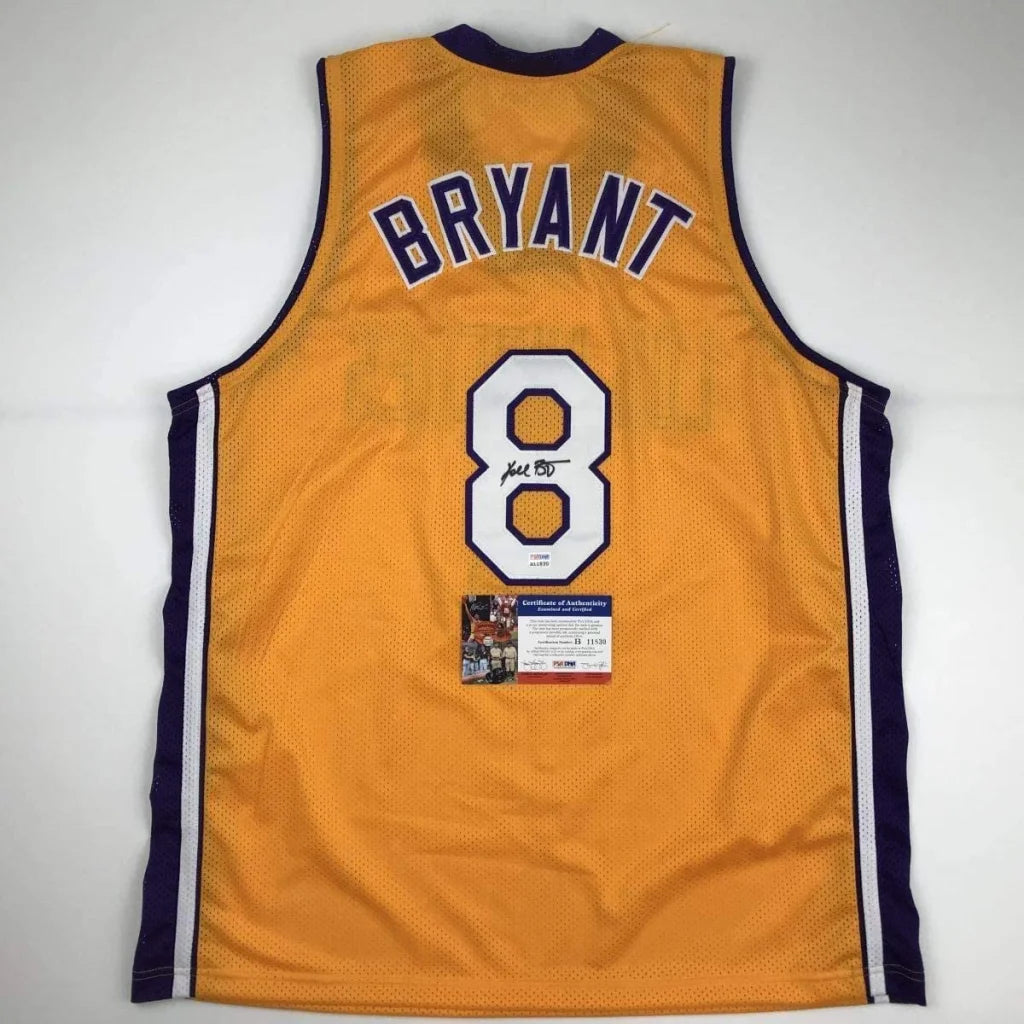 Autographed Kobe Bryant #8 golden custom jersey with navy trim, PSA/DNA COA