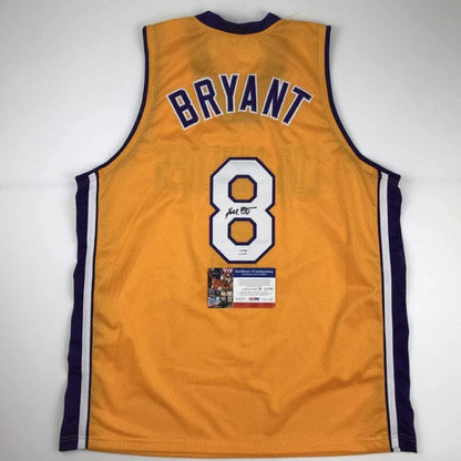 Autographed Kobe Bryant #8 golden custom jersey with navy trim, PSA/DNA COA