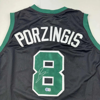 Black mesh Porzingis custom jersey with green trim, signed, for professional sports fans