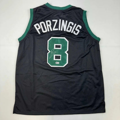Black Porzingis custom jersey with green trim, signed, for professional sports fans