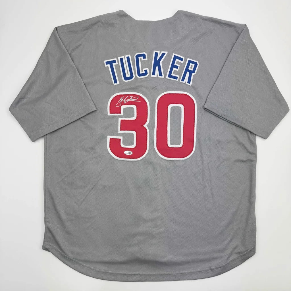 Gray custom jersey from professional sports league with TUCKER 30 on back