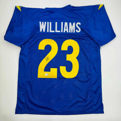 Blue custom jersey with yellow numbers and signature, perfect for professional sports fans