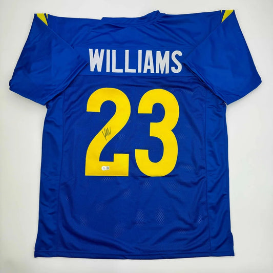 Blue custom jersey with yellow numbers and signature, perfect for professional sports fans
