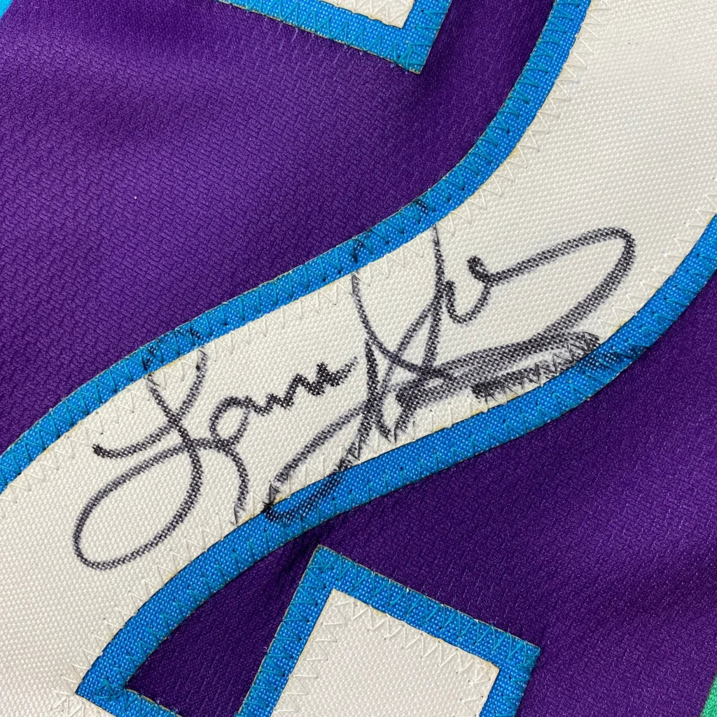 Autographed purple and teal custom jersey from Johnson Basketball sports league