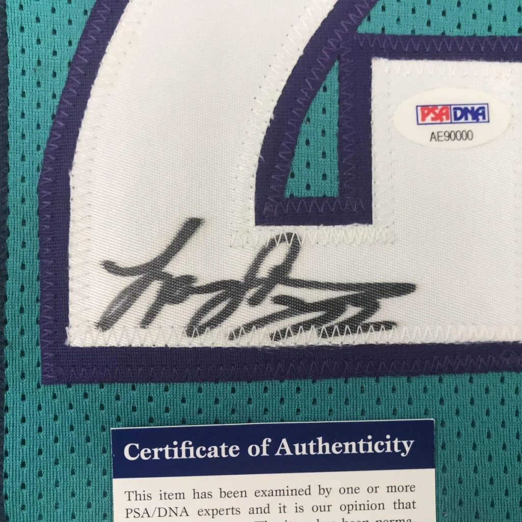 Autographed Johnson Charlotte Teal custom jersey with PSA DNA COA for authenticity