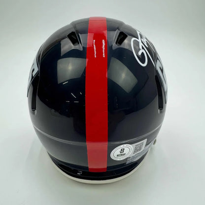 Dark blue Giants football helmet with red stripe and white signature, third party authentication