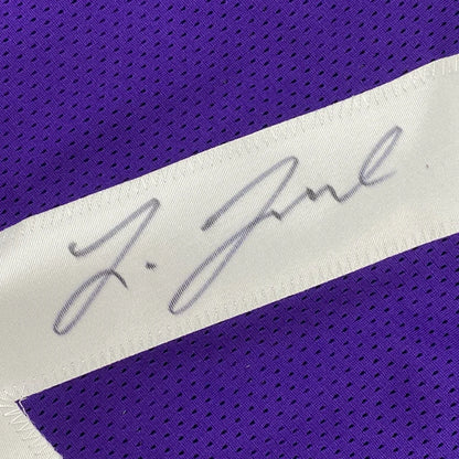 Autographed purple mesh custom jersey with white stripe and silver ink signature from professional sports league athlete