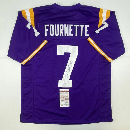 Back of purple louisiana tech bulldogs custom jersey with white and gold trim featuring fournette number 7 for professional sports league fans