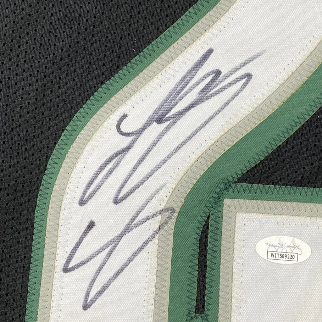 Autographed custom jersey from a professional sports league with authentication sticker