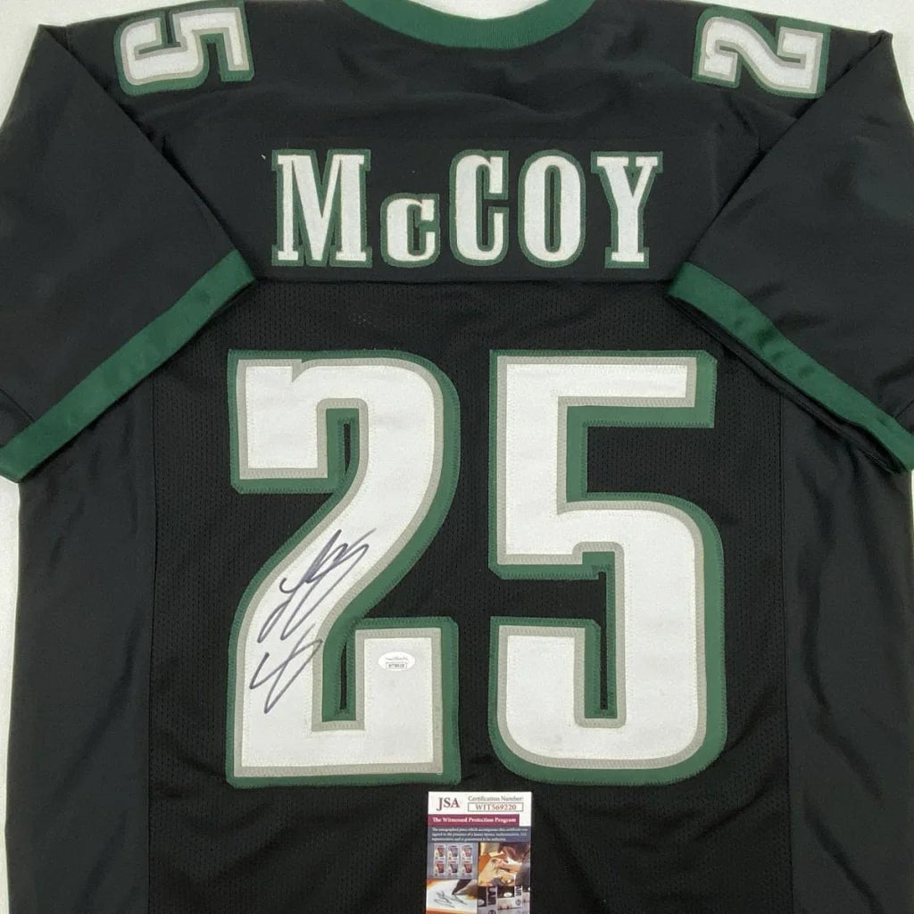 Autographed black custom jersey with green and white trim from Professional Sports League