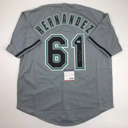 Back of gray custom jersey with black and green trim featuring hernandez 61 for professional sports league use