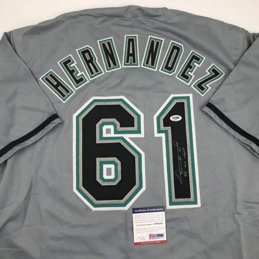 Back of gray custom jersey with black and green lettering signed by livan hernandez from professional sports league