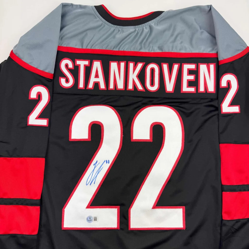 Autographed Logan Stankoven custom black hockey jersey with red accents, Stankoven 2 on back, Beckett COA