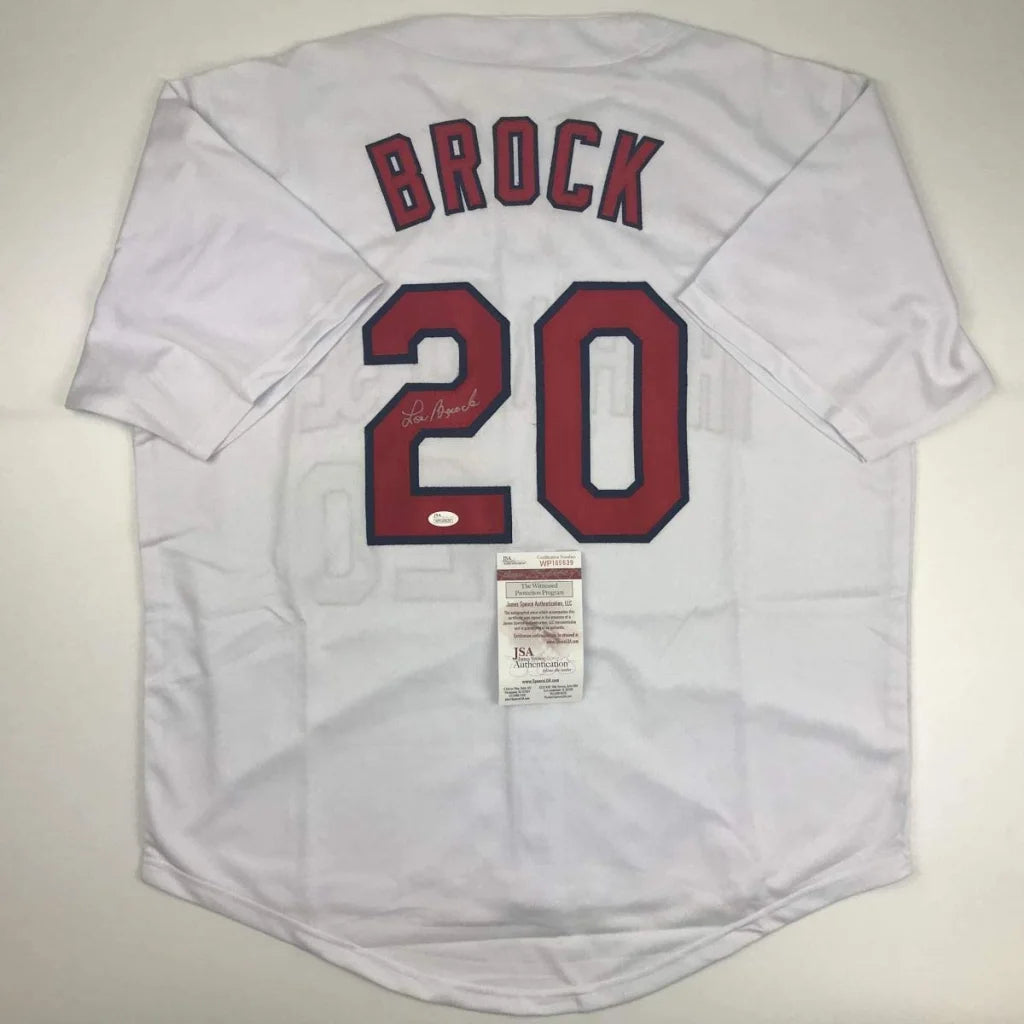 White Lou Brock signed custom jersey from professional sports league with JSA sticker
