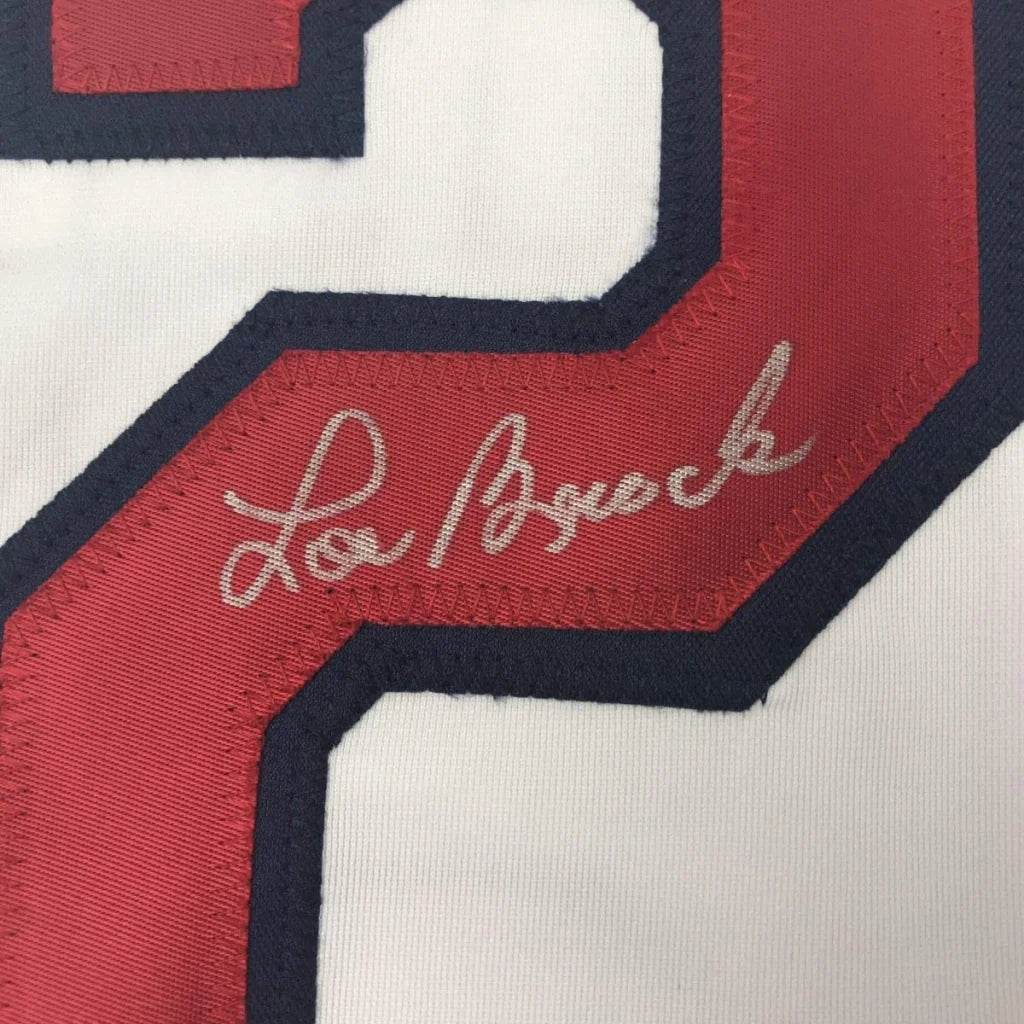White custom jersey with red and navy trim and Lou Brock autograph from professional sports league