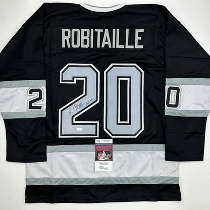 Black custom Jersey signed by Luc Robitaille in professional sports league with PSA/DNA sticker