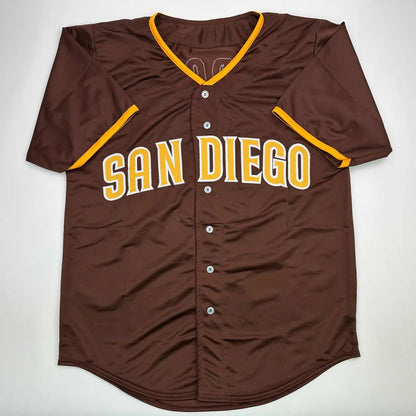 Brown short-sleeve custom jersey with SAN DIEGO in yellow, autographed by a pro sports star