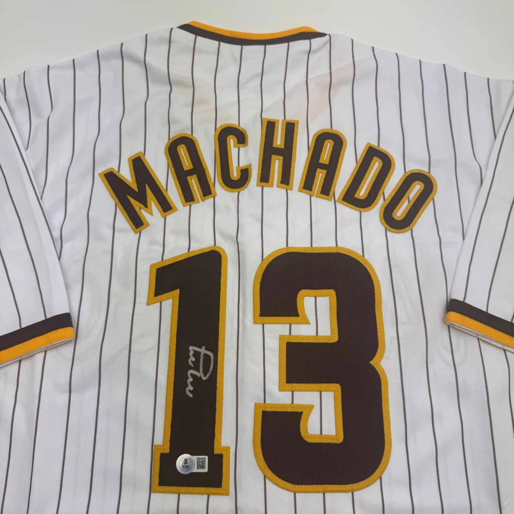 Autographed Manny Machado San Diego Pinstripe Baseball Jersey Beckett BAS COA | Certified Authentic Signed Memorabilia | vintageantiquesgifts.com