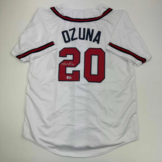 White Ozuna custom jersey with Beckett BAS COA, pro sports autograph, red and black trim