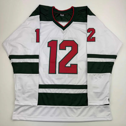 White hockey jersey with dark green shoulders and red 12 from Professional Sports League