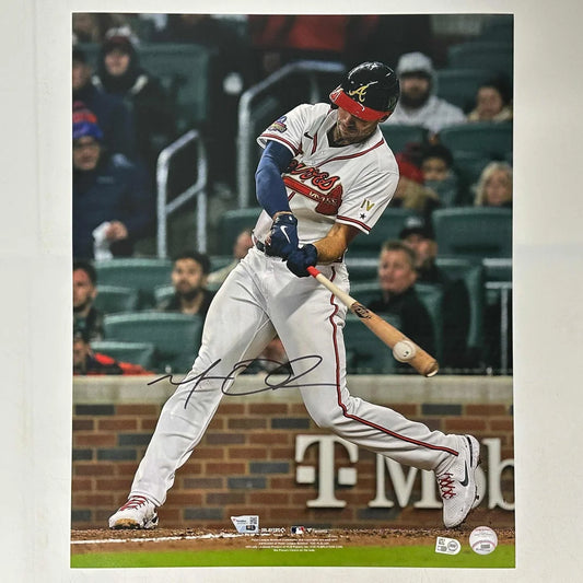 Autographed Atlanta Braves batting photo with verification showcasing a player swinging a bat