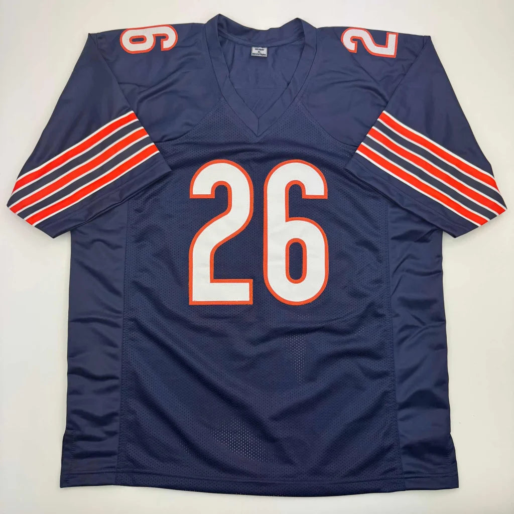 Navy blue American football jersey with orange and white stripes from the professional sports league