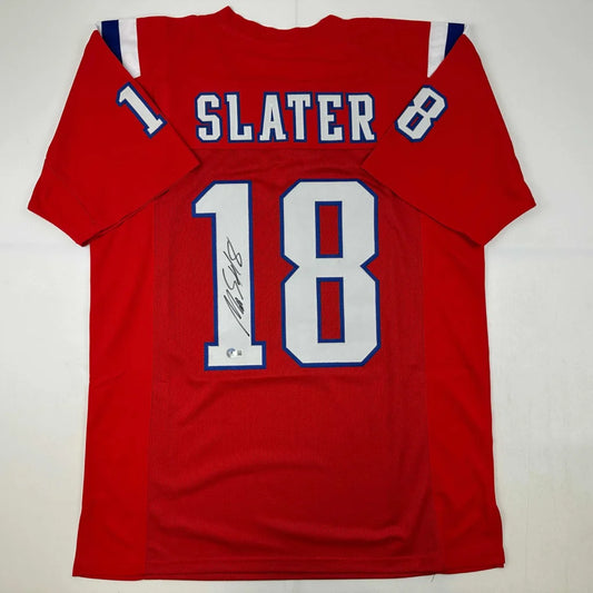 Back of autographed Matthew Slater red New England custom jersey, number 18, professional sports league