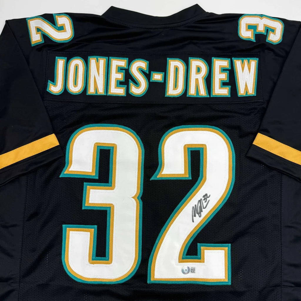 Autographed Maurice Jones-Drew Jacksonville Jaguars black custom jersey, number 32, signed by Drew Brees, professional sports league