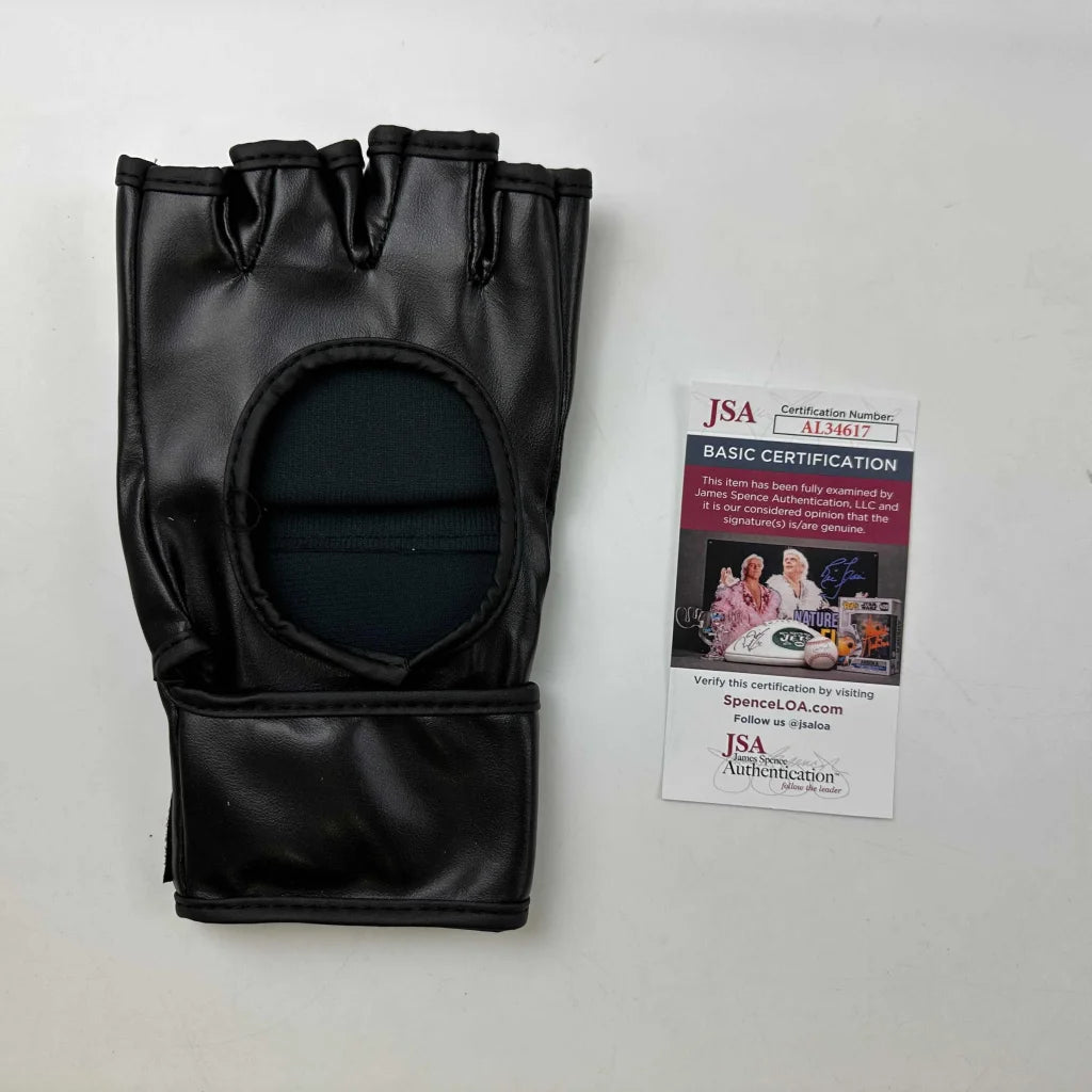 Black fingerless UFC MMA glove with oval cutout, third party authentication included