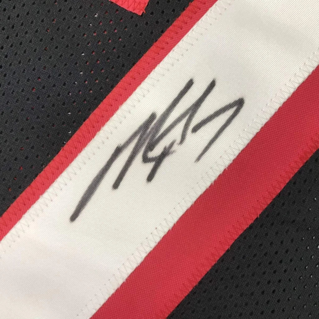 Autographed black and red custom jersey from Vick 7 for football sports league fans