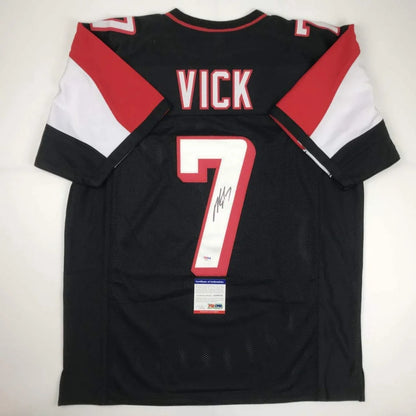 Black custom jersey with red and white accents signed by Vick number 7 for sports league fans