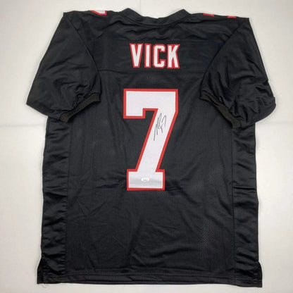 Black custom jersey with VICK 7 signed, perfect for sports league fans in professional sports