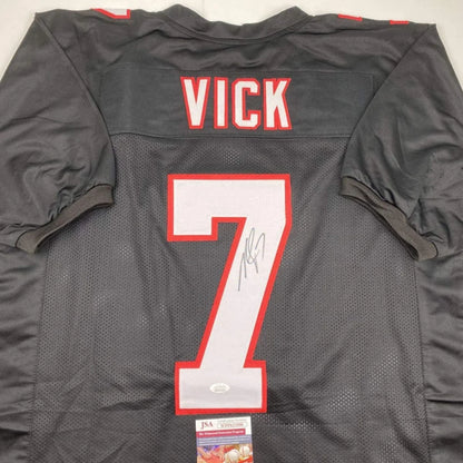 Black and red custom jersey with number 7 signed by Michael Vick for professional sports