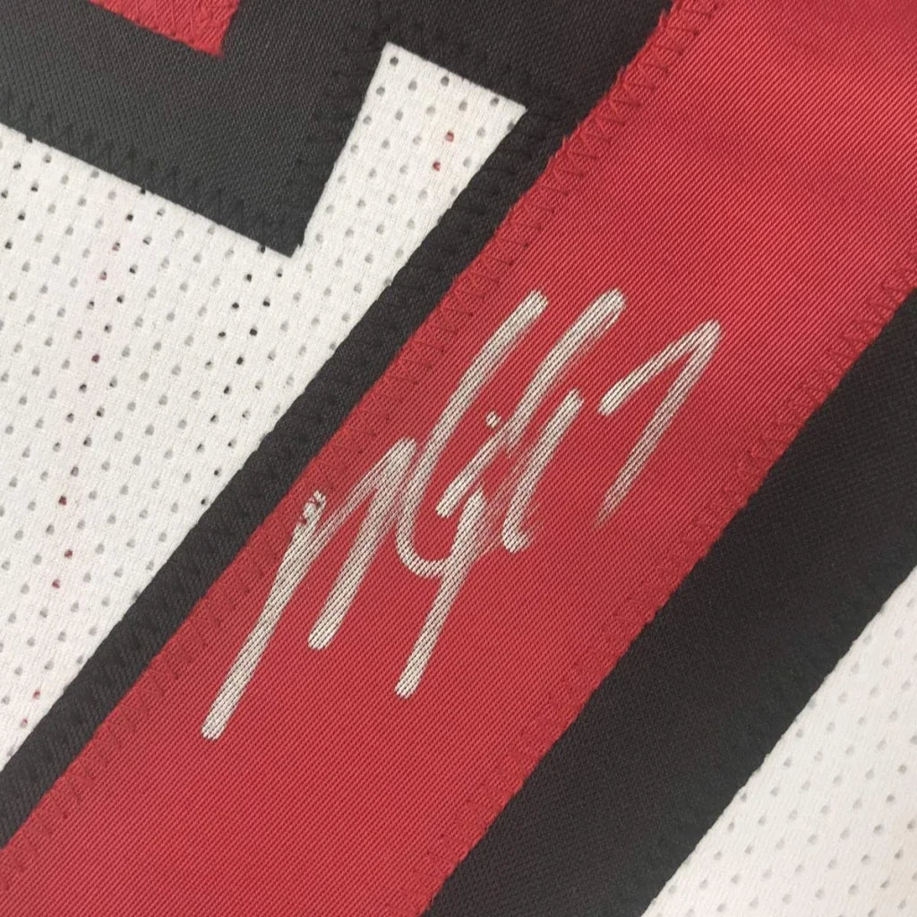 Autographed professional sports custom jersey featuring Michael Vick for sports league fans