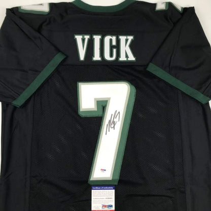 Black Michael Vick pro sports league jersey with autograph and certificate of authenticity