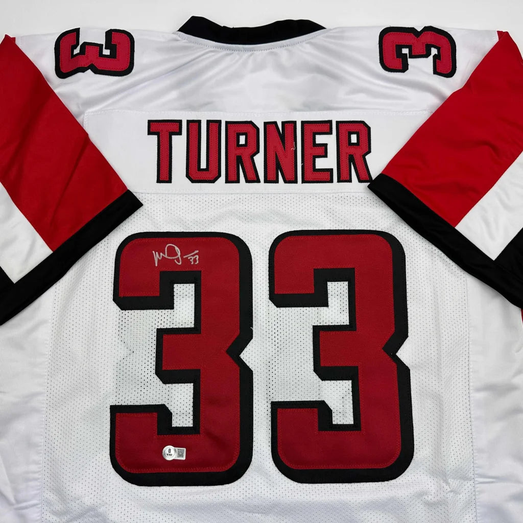 Autographed Michael Turner Atlanta White Football Jersey Beckett BAS COA | Certified Authentic Signed Memorabilia | vintageantiquesgifts.com
