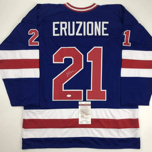 Back of blue custom hockey jersey with red and white stripes featuring eruzione 21 for professional sports league use